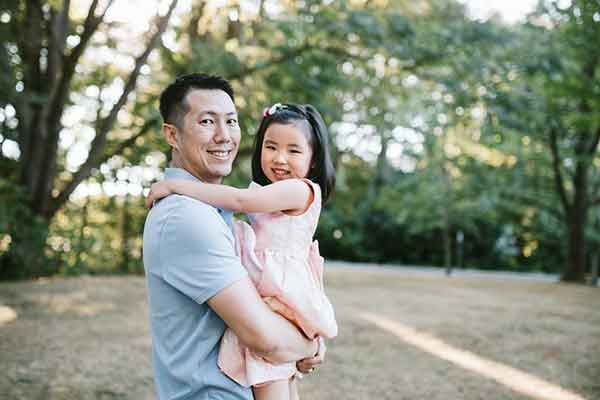 Father hugging daughter