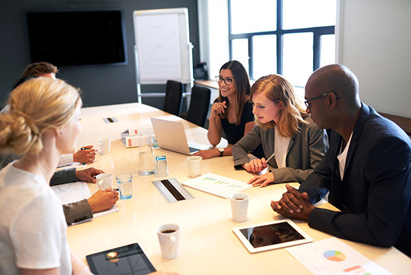 Group of young executives having a work meeting